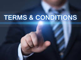 Businessman in a suit pointing at glowing 'Terms & Conditions' text on a digital screen